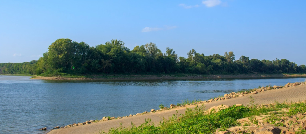 Two smooth rivers converve among the wooded bottoms